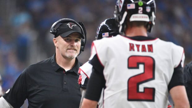 Sep 24, 2017; Detroit, MI, USA; Atlanta Falcons head coach Dan Quinn high fives quarterback Matt Ryan (2) during the fourth quarter against the Detroit Lions at Ford Field.